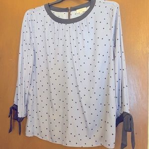 L/S baby blue top with navy trim and polka dots.